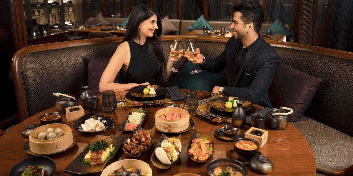 Couple dining at Conrad Pune Luxury by Hilton restaurant